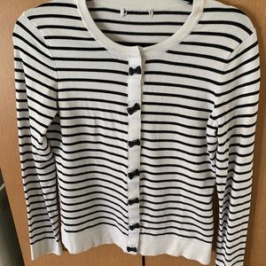 Black and white striped sweater, black bow snap detail, size M